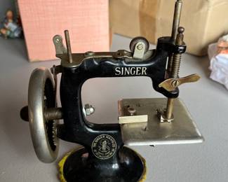 Antique Singer child’s sewing machine.