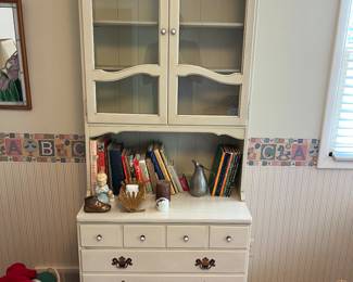 Ethan Allen cabinet with glass doors and storage.