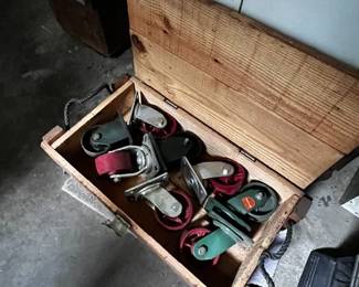 Casters of various sizes and wooden box