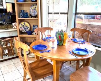 The table, its leaf and the 4 chairs are in great condition. To the left of the table is a matching bookcase with adjustable shelves.   Don't miss the RARE vintage hot peppers cookie jar sitting on the table. Hanging from the ceiling is a vintage macrame plant hanger.