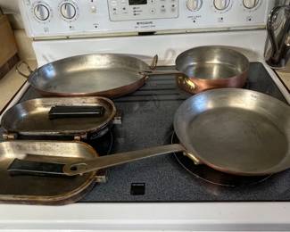 There are 2 Williams Sonoma skillets and one fish au gratin pan.