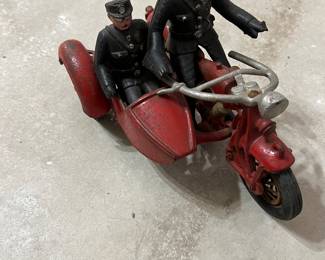  This is a cast iron Hubley motorcycle and side car.