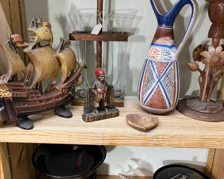 The lotus flower that is to the right of the southwestern pitcher is hand carved and the bloom opens and closes,