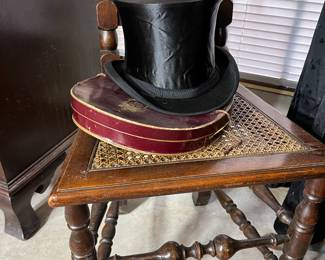 This is the top hat that goes with the gentleman's suit. The hat flattens for storage and fits in the box below.