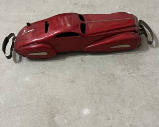 This old red car is named Marx Marvel # 71.  It is a tin windup bumper car made in 1930's.
