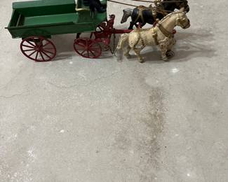 This is a Kenton green cast iron 5-ton horse drawn wagon made between 1890 and 1952.