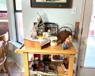 The rolling cart matches the table and the bookcase. It is ready to use inside or outside.  Bookcase is 26"wide, 34" tall and 20"deep. Above the cart is a great  framed watercolor.