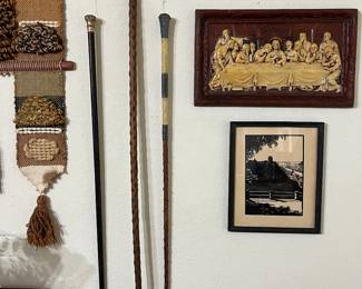 Hanging on the wall are 3 vintage canes that are in great condition.