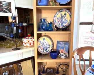 Bookcase is 2 feet wide and 7 feet tall. The top shelf holds several pieces of Delft pottery from Holland.  The second shelf displays a Hall antique teapot. On the fourth shelf is a great vintage cookbook by Betty Crocker titled Dinner for Two and a Fiesta pitcher.