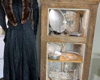 The Victorian 2-piece dress is handmade and is in excellent condition.  The wonderful old icebox has had its doors removed but they are available to the buyer. The icebox measures 27" x 57" and is 19" deep.