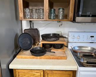 This picture is right out of the early 1900's.  The quart and pint E z open glass jars fill the shelves.  The antique skillets are resting on a very old butcher block.