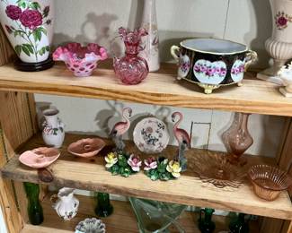 Did you spot the 2 lovely pieces of Fenton glass on the top shelf? On the second shelf are 2 sets of candle holders and another piece of Murano styled glass swan is on the third shelf. Check out the amazing flamingos!!!