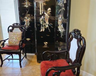  Black lacquer screen with elaborate inlaid designs.