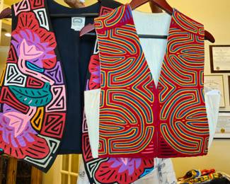 Examples of mola vests and strikingly different designs. The one on the right is more typical of the intricate early San Blas islanders' work