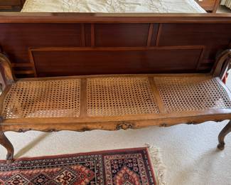Beautiful carved bench with woven seat