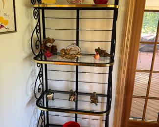 One of two metal and glass display shelves with gold trim
