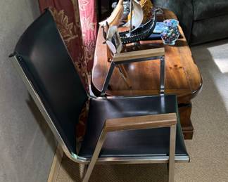 Pair of MCM black, chrome armchairs