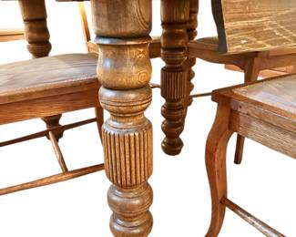 A fine antique dining table by Robbins Table Co. Has a unique storage space that contains the table’s 6 leaves!