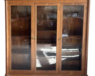 Gorgeous antique display case on original wooden wheels