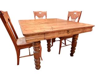 A fine antique dining table by Robbins Table Co. Has a unique storage space that contains the table’s 6 leaves!