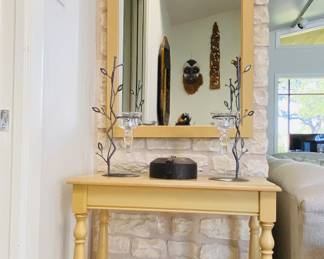 entry hall console and mirror with brass hooks