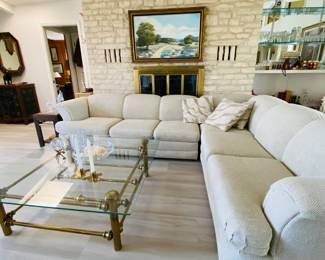 contemporary sectional sofa with sleeper , brass and glass vintage coffee table