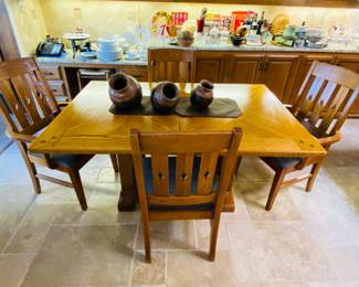 Mission style oak dining table with 8 chairs and extension leaf