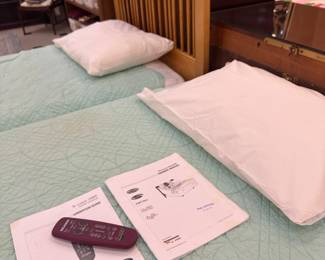 Two twin beds - one is a power adjustable bed