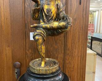 Buddah  (one leg sitting tree pose) statue - marble base - on three hoofed tripod stand.