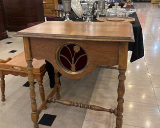 This piece is inlaid with maroon velvet.