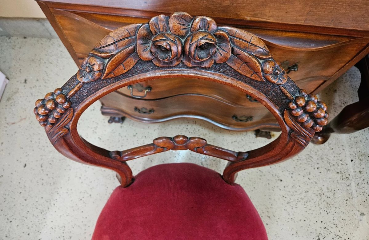 Antique floral carved chair with velvet upholstery 