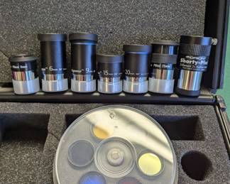 Case with different lenses for telescope.