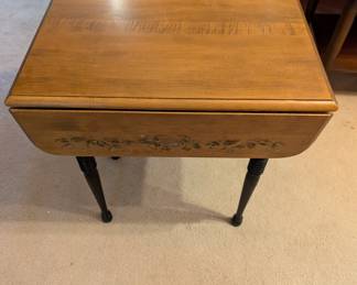$45 - Decorated Wood Table that folds down on the end.