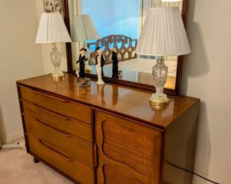 Mid-Century Modern Dresser with Mirror = 54.25" long, 20" deep, 31.75" tall. Has four drawers showing and more drawers on right behind door.