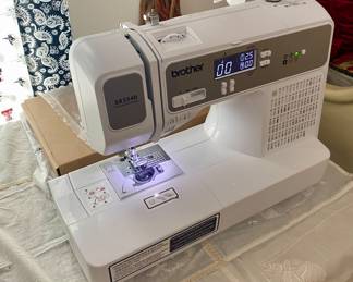Brother XR3340 sewing and quilting machine complete with parts, manual and tabletop extender. 