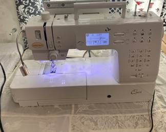 baby lock quest quilting sewing machine. Complete with all parts manual and portable acrylic stabilizing table 