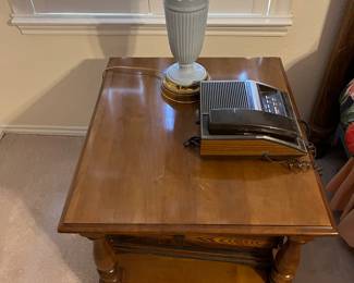 walnut coffee table with a Wedgewood lamp