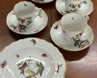 Herend teacups and saucers and dessert plates.