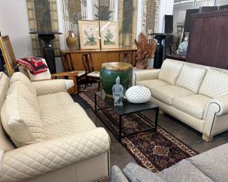 Excellent condition, white quilted leather sofas. 