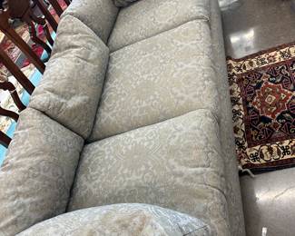 Sofa with gray upholstery. 