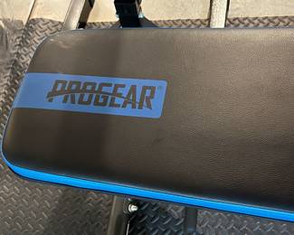 Progear weight bench with barbell rack and plates 