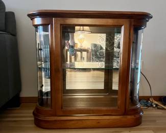 Pulaski rounded glass lighted curio cabinet