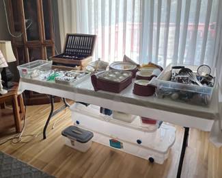 Sangostone dishes, Nortake china, silverware, lighted curio cabinet