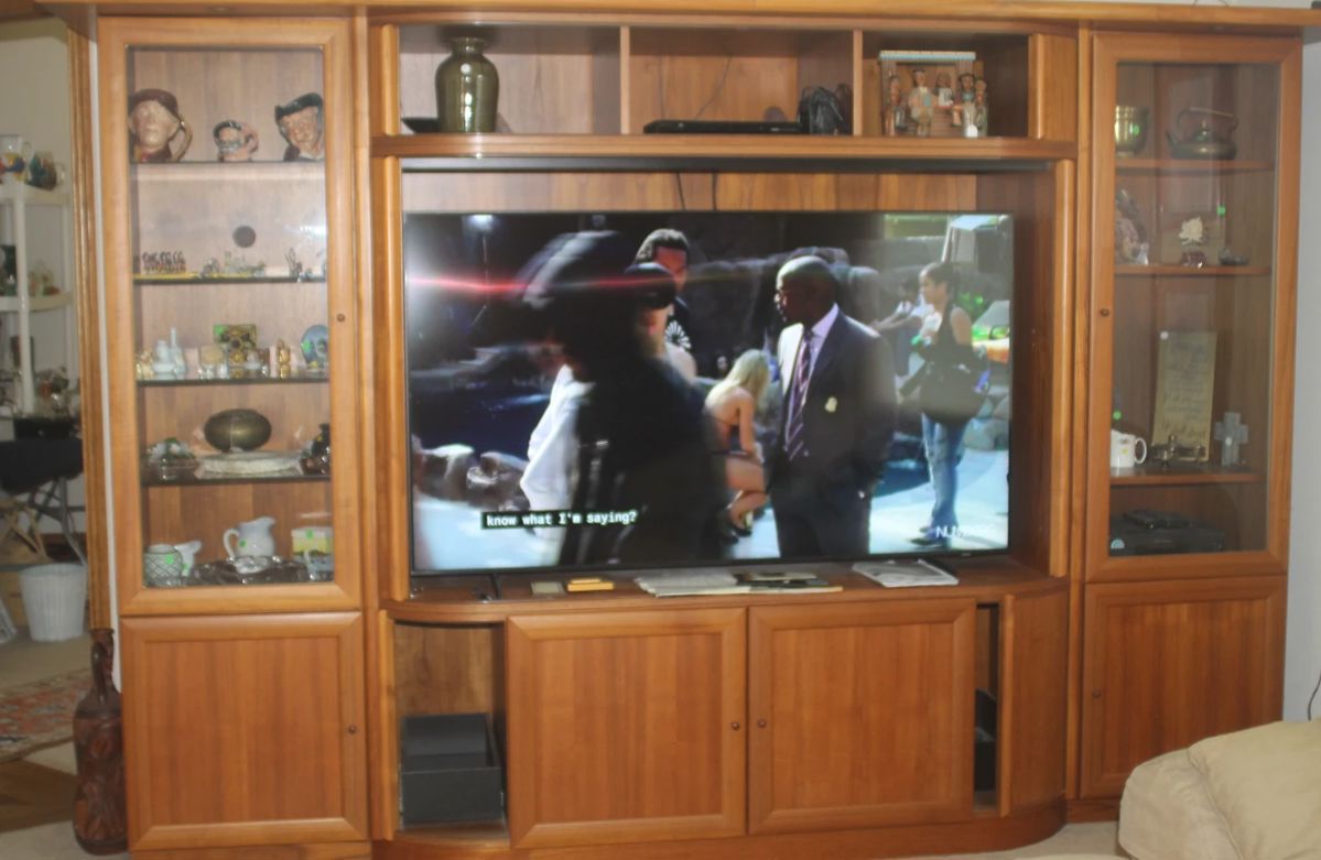 Large console to hold very large TV, paid 5300.00 for cabinet made from teak wood selling for 2100.00