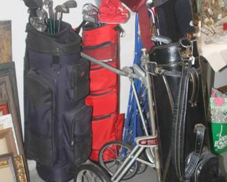 Three sets of gold clubs