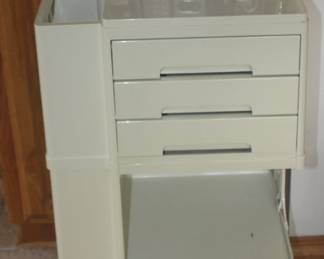 Three drawers on wheels cabinet
