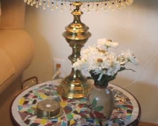 Brass lamp with green shade and mosiac table