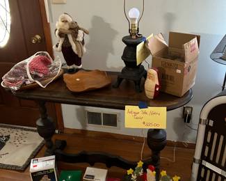 Antique sofa table, Cast iron stove lamp, and holiday decor