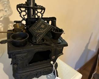 Vintage cast iron miniature stove with all pots and pans