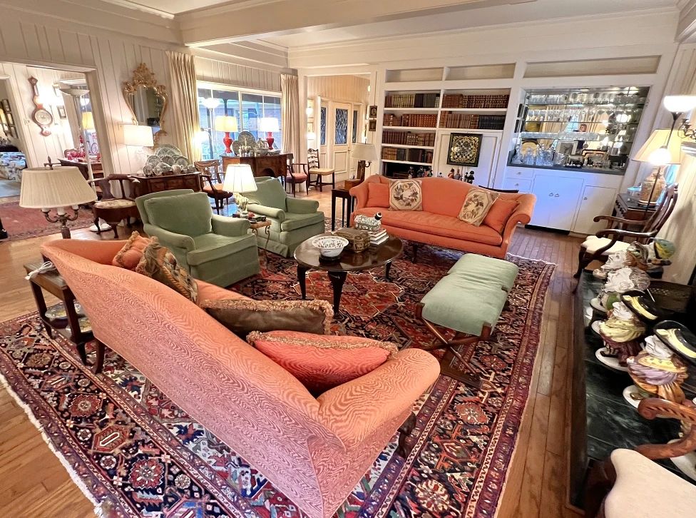Amazing living room with antiques, Oriental rugs, mohair club chairs, Italian figurines, Chinoiserie pieces